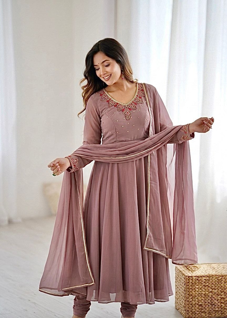 Astonishing faux georgette peach suit set
