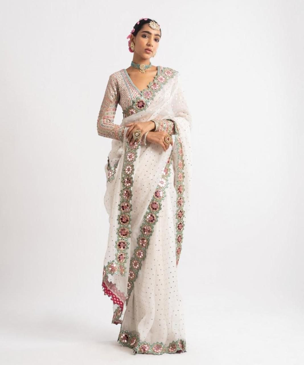 Presenting embroidery sequence georgette white saree